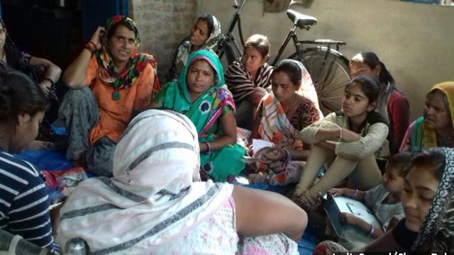 Zuhra Bano (in orange), a Self Help Group (SHG) leader, signed up to be trained as a Community Nutrition Advisor, which meant she would share health, nutrition and household finance information with members of her SHG and interact with the women’s husbands to tell them how important is it to make decisions about health and food jointly. (IndiaSpend/Charu Bahri) Zuhra Bano (in orange), a Self Help Group (SHG) leader, signed up to be trained as a Community Nutrition Advisor, which meant she would share health, nutrition and household finance information with members of her SHG and interact with the women’s husbands to tell them how important is it to make decisions about health and food jointly. (IndiaSpend/Charu Bahri)