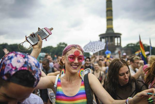 Costumed participants take part in the Christopher Street Day parade in Berlin on July 22. In background the Victory Column.  (AP Photo)