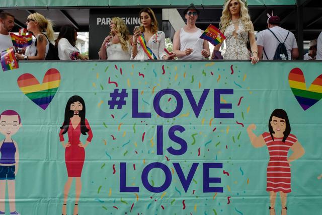 Participants ride in a "Love is Love" float during Berlin's annual Christopher Street Day (CSD) gay pride parade on July 22.  (AFP Photo)