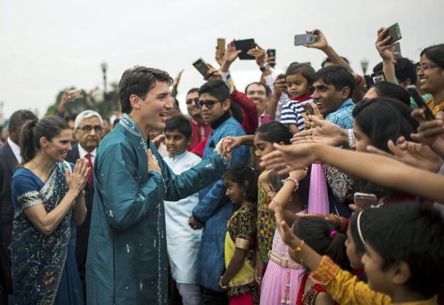 Canada's Prime Minister Justin Trudeau greets people as he visits the BAPS Shri Swaminarayan Mandir to celebrate the 10th anniversary of the Hindu temple. (AP) Canada's Prime Minister Justin Trudeau greets people as he visits the BAPS Shri Swaminarayan Mandir to celebrate the 10th anniversary of the Hindu temple. (AP)