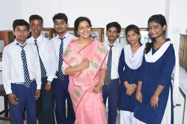 Singh: Happy teacher with her students. (HT Photo)