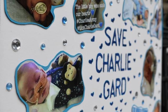 A picture shows a poster set up by supporters of the family of British baby Charlie Gard outside the Royal Courts of Justice in London. (AFP Photo) A picture shows a poster set up by supporters of the family of British baby Charlie Gard outside the Royal Courts of Justice in London. (AFP Photo)