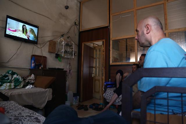 Syrian patients watch TV in a room at the mental health clinic in the town of Azaz, near the border with Turkey, on July 6, 2017. (AFP) Syrian patients watch TV in a room at the mental health clinic in the town of Azaz, near the border with Turkey, on July 6, 2017. (AFP)