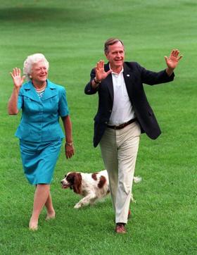 President Bush and first lady Barbara Bush walking with their dog Millie across the South Lawn as they return to the White House.  (AP File Photo)