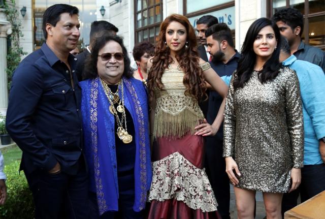 (L-R) Filmmaker Madhur Bhandarkar, music composer Bappi Lahiri, makeover expert Ishika Taneja and actress Kirti Kulhari at an event. (IANS)