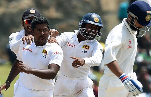 Sri Lanka cricket team’s Rangana Herath (2L) celebrates with teammates after dismissing Ajinkya Rahane (R) during the fourth day of the opening Test match against Indian cricket team at the Galle International Cricket Stadium on August 15, 2015. Herath ran through the Indian batting with figures of 7/48. (Getty Images) Sri Lanka cricket team’s Rangana Herath (2L) celebrates with teammates after dismissing Ajinkya Rahane (R) during the fourth day of the opening Test match against Indian cricket team at the Galle International Cricket Stadium on August 15, 2015. Herath ran through the Indian batting with figures of 7/48. (Getty Images)