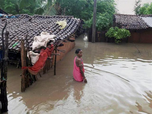 A flood victim coming out of her house in Kalyansingpur village in Rayagada district, Odisha on July 17, 2017. (PTI)
