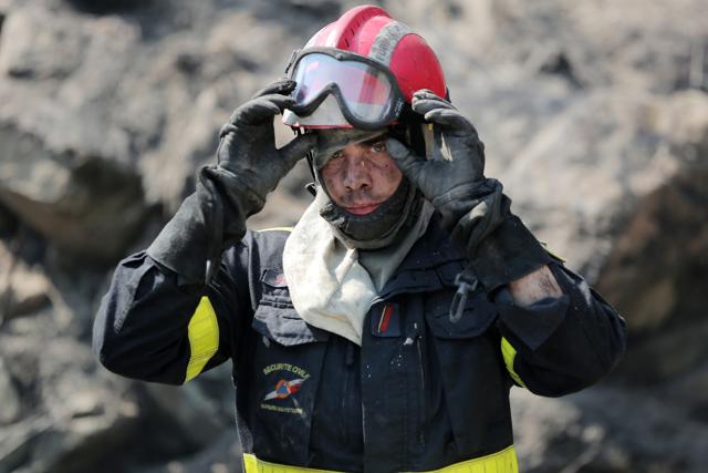 A firefighter takes a break at the site of a wildfire near the village of Ortale, Corsica island, France, Tuesday, July 25, 2017. (AP Photo) A firefighter takes a break at the site of a wildfire near the village of Ortale, Corsica island, France, Tuesday, July 25, 2017. (AP Photo)