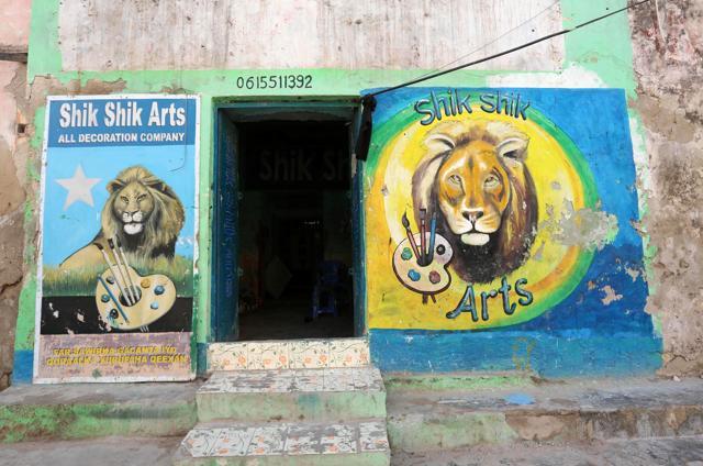 A mural depicting lions advertises Shik Shik’s services outside his art shop in Hamarweyne district of Mogadishu. (Feisal Omar / REUTERS) A mural depicting lions advertises Shik Shik’s services outside his art shop in Hamarweyne district of Mogadishu. (Feisal Omar / REUTERS)