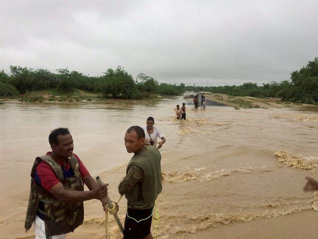 JArmy personnel carry out rescue operation during floods in Rajasthan on Tuesday. (PTI) JArmy personnel carry out rescue operation during floods in Rajasthan on Tuesday. (PTI)