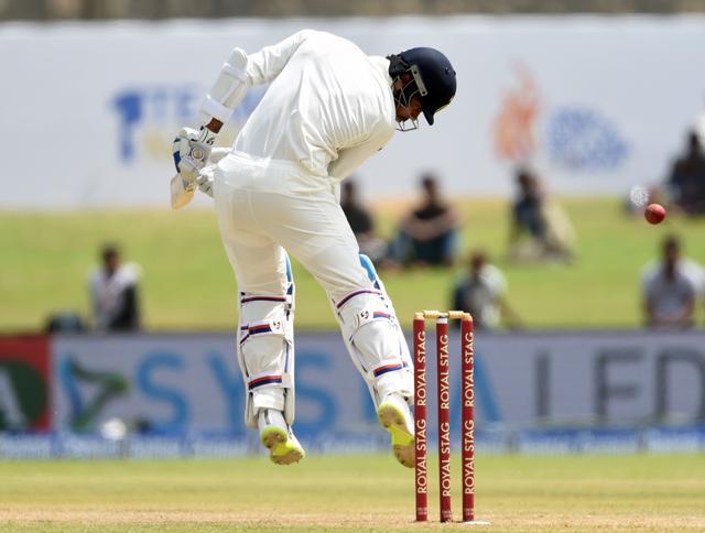 Indian batsman Cheteshwar Pujara is hit by a bouncer bowled by Sri Lankan bowler Nuwan Pradeep in Galle Test on Thursday. (AFP) Indian batsman Cheteshwar Pujara is hit by a bouncer bowled by Sri Lankan bowler Nuwan Pradeep in Galle Test on Thursday. (AFP)