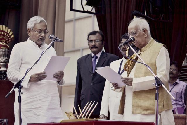 Bihar Governor Keshari Nath Tripathi administers oath to JD(U) National President Nitish Kumar as Bihar Chief MInister at Raj Bhawan, in Patna on Thursday. (PTI) Bihar Governor Keshari Nath Tripathi administers oath to JD(U) National President Nitish Kumar as Bihar Chief MInister at Raj Bhawan, in Patna on Thursday. (PTI)
