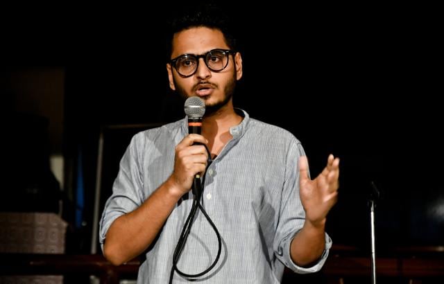 Budding comedian Neeraj Pandey performs at an open mic session organised by The Awkward Fruit at QTube Cafe in Bandra. (Shashi S Kashyap/ HT Photo)