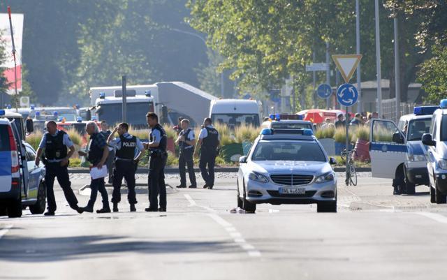 Police and ambulances stand near the disco Club Grey in the southern German town of Konstanz, where a gunman opened fire, killing one and wounding four people before being shot by police, on July 30, 2017. (AFP Photo)
