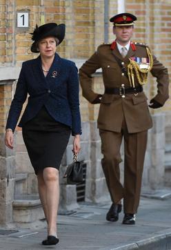 Britain's Prime Minister Theresa May arrives to attend a ceremony marking the centenary of the battle of Passchendaele, one of the bloodiest of World War 1, during the Last Post ceremony at the Commonwealth War Graves Commission in Ypres (Menin Gate) Memorial in Western Flanders on July 30, 2017. (AFP)