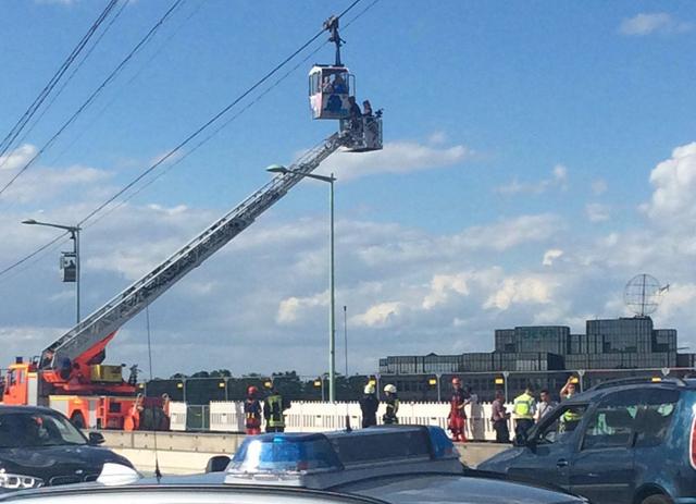 Fire service personnel rescue people from a cable car gondola in Cologne, Germany. (Photo: PTI/DPA)