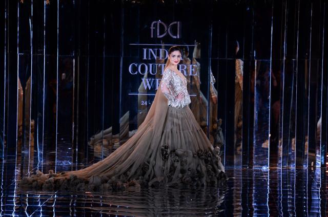Alia Bhat flaunts a creation by Manish Malhotra during the FDCI India Couture week 2017 in New Delhi on July 30. (AFP)