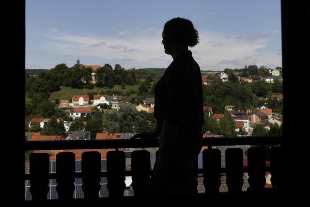 Capt Jennifer Sims is silhouetted on a balcony after an interview with The Associated Press. (AP Photo) Capt Jennifer Sims is silhouetted on a balcony after an interview with The Associated Press. (AP Photo)