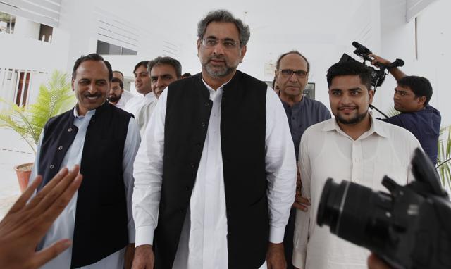 Pakistan's premier-designate Shahid Khaqan Abbasi (centre) leaves with his aides after meeting politicians in Parliament in Islamabad on July 31, 2017. Pakistan's Parliament will meet on Tuesday to elect a new prime minister after the disqualification of three-term premier Nawaz Sharif. (AP) Pakistan's premier-designate Shahid Khaqan Abbasi (centre) leaves with his aides after meeting politicians in Parliament in Islamabad on July 31, 2017. Pakistan's Parliament will meet on Tuesday to elect a new prime minister after the disqualification of three-term premier Nawaz Sharif. (AP)
