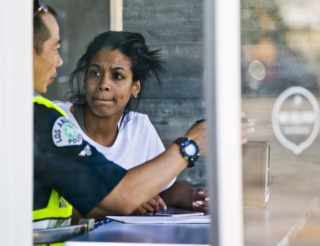 An official, left, interviews a witness after a van plowed into a group of people on a Los Angeles sidewalk on Sunday, July 30, 2017. (AP Photo) An official, left, interviews a witness after a van plowed into a group of people on a Los Angeles sidewalk on Sunday, July 30, 2017. (AP Photo)