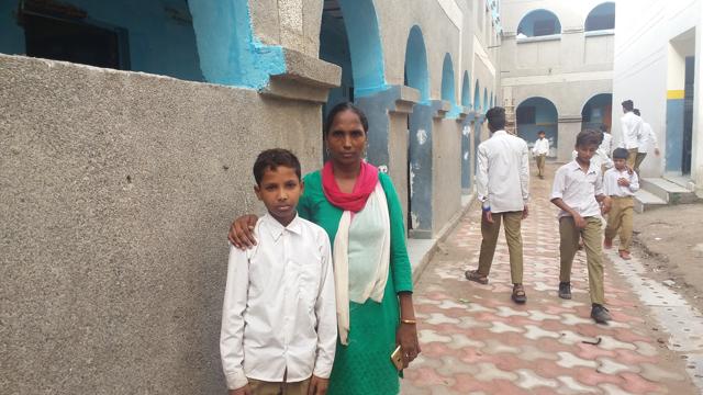 With his mother at his new school in New Seemapuri. (Shiv Sunny/HT Photo) With his mother at his new school in New Seemapuri. (Shiv Sunny/HT Photo)