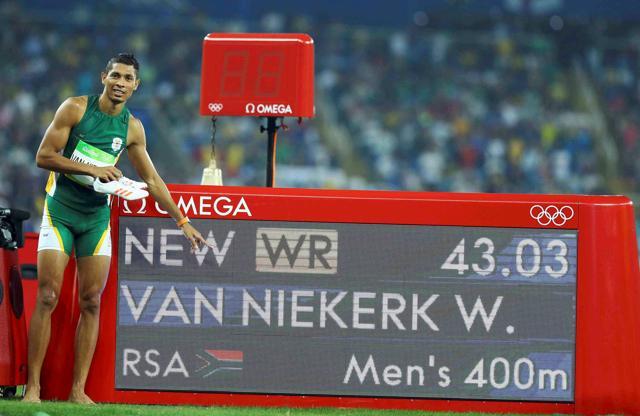 Gold medallist Wayde van Niekerk (RSA) of South Africa points to the board showing his new world new record. (REUTERS) Gold medallist Wayde van Niekerk (RSA) of South Africa points to the board showing his new world new record. (REUTERS)