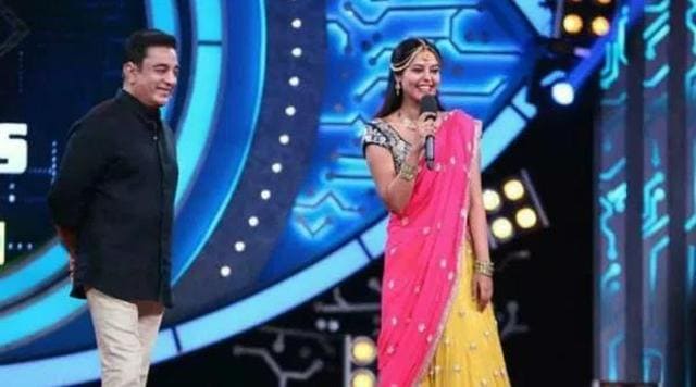 Oviya shares the Bigg Boss stage with the show’s host Kamal Haasan.