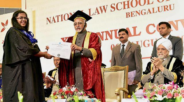 Vice President Hamid Ansari presenting certificate to meritorious students as Chief Justice of India Justice JS Khehar looks on, at the "25th Annual Convocation of National Law School of India University" in Bengaluru on Sunday. (PTI) Vice President Hamid Ansari presenting certificate to meritorious students as Chief Justice of India Justice JS Khehar looks on, at the "25th Annual Convocation of National Law School of India University" in Bengaluru on Sunday. (PTI)