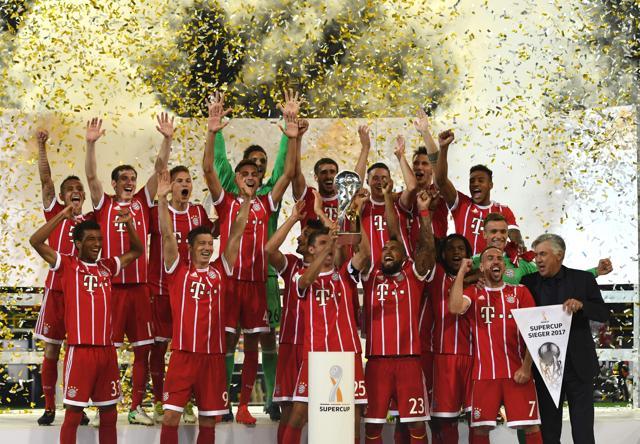 Bayern Munich´s players celebrate after winning the German Supercup against Borussia Dortmund. (AFP)