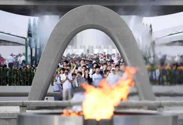 People pray for atomic bomb victims in front of the cenotaph for the victims of the 1945 atomic bombing, at Peace Memorial Park in Hiroshima. (REUTERS) People pray for atomic bomb victims in front of the cenotaph for the victims of the 1945 atomic bombing, at Peace Memorial Park in Hiroshima. (REUTERS)