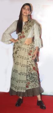 Sonam Kapoor pairs her sari ‘cropped’, with boots. Sonam Kapoor pairs her sari ‘cropped’, with boots.