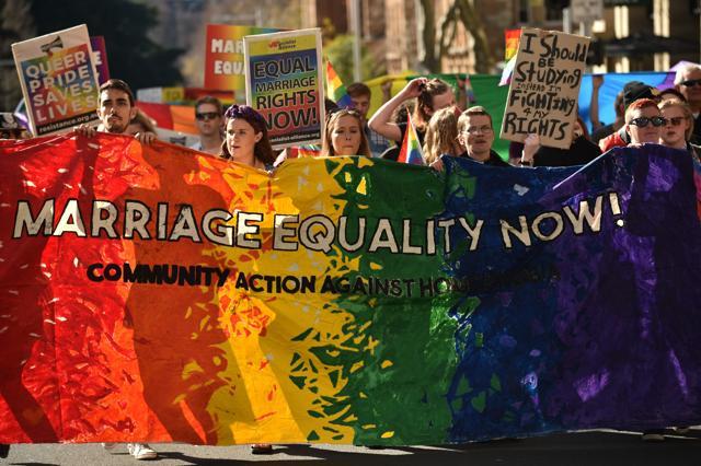 Supporters of same sex marriage carry banners and shout slogans as they march in Sydney on August 6, 2017. (AFP) Supporters of same sex marriage carry banners and shout slogans as they march in Sydney on August 6, 2017. (AFP)