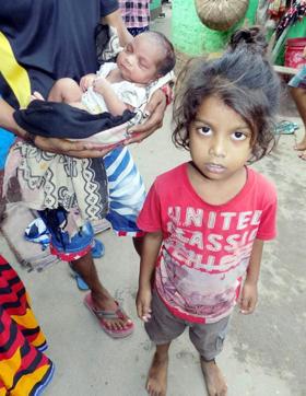 Victim Seema Devi's six-year-old son and six-day-old daughter. (HT photo) Victim Seema Devi's six-year-old son and six-day-old daughter. (HT photo)