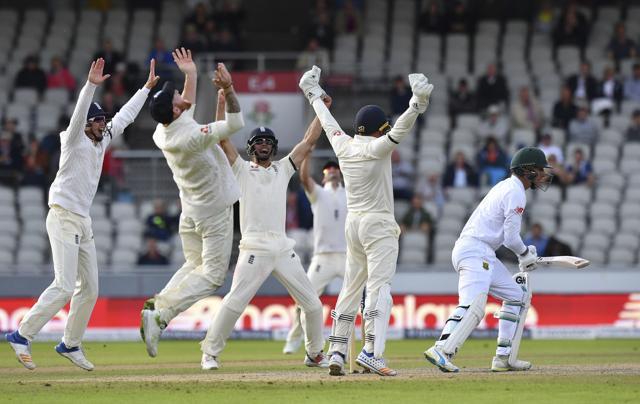 South Africa's Duanne Olivier, right, is caught by England's Ben Stokes, 2nd left, as England win the fourth Test match at Old Trafford in Manchester, Monday. (AP) South Africa's Duanne Olivier, right, is caught by England's Ben Stokes, 2nd left, as England win the fourth Test match at Old Trafford in Manchester, Monday. (AP)
