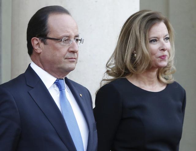 In this Sept. 3, 2013 file photo, French president Francois Hollande and his companion Valerie Trierweiler wait for German President Joachim Gauckand, at the Elysee Palace, in Paris. (AP) In this Sept. 3, 2013 file photo, French president Francois Hollande and his companion Valerie Trierweiler wait for German President Joachim Gauckand, at the Elysee Palace, in Paris. (AP)