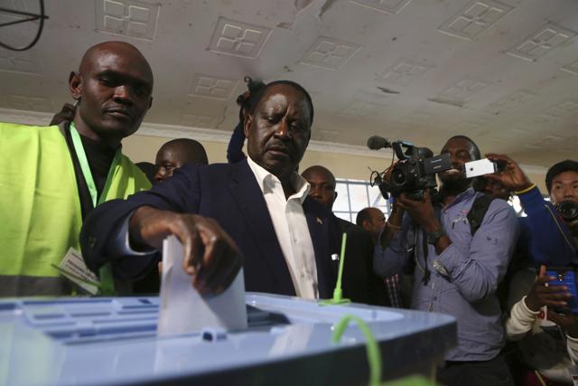 Kenyan Opposition leader Raila Odinga, second left, casts his vote in the Kibera slum in Nairobi, Kenya, Tuesday, Aug.8, 2017. (AP) Kenyan Opposition leader Raila Odinga, second left, casts his vote in the Kibera slum in Nairobi, Kenya, Tuesday, Aug.8, 2017. (AP)
