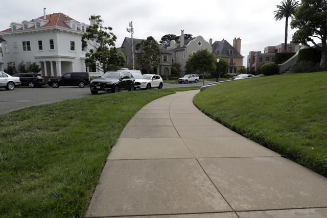A sidewalk leads into luxury homes in the Presidio Terrace neighbourhood in San Francisco. (AP) A sidewalk leads into luxury homes in the Presidio Terrace neighbourhood in San Francisco. (AP)