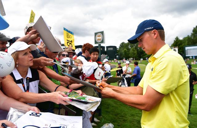 Jordan Spieth of the United States signs autographs for fans during a practice round prior to the 2017 PGA Championship at Quail Hollow Club on Wednesday. (AFP)