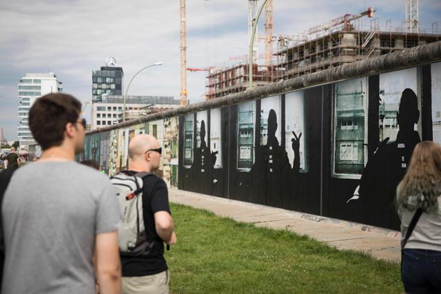 The open air installation along the East Side Gallery section of the Wall combines video stills of the former border area between East and West Berlin. (AFP Photo) The open air installation along the East Side Gallery section of the Wall combines video stills of the former border area between East and West Berlin. (AFP Photo)