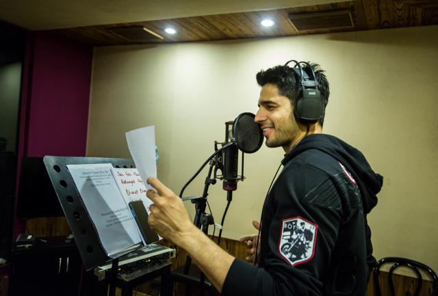 Sidharth records his portion of the song.