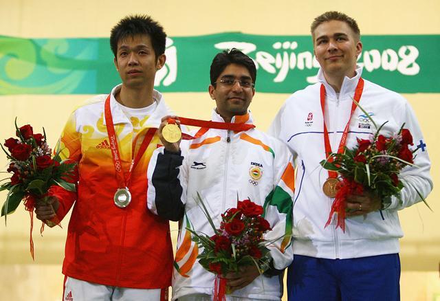 L-R) Silver medalist Zhu Qinan of China, Gold medalist Abhinav Bindra of India and Bronze medalist Henri Hakkinen of Finland pose after the Men's 10m Air Rifle Final at the Beijing Shooting Range Hall on August 11, 2008 in Beijing. (Getty Images) L-R) Silver medalist Zhu Qinan of China, Gold medalist Abhinav Bindra of India and Bronze medalist Henri Hakkinen of Finland pose after the Men's 10m Air Rifle Final at the Beijing Shooting Range Hall on August 11, 2008 in Beijing. (Getty Images)