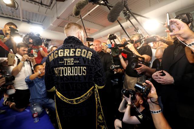 Conor McGregor of Ireland wears a new custom-made robe as he talks with reporters following a workout at the UFC Performance Center in Las Vegas, Nevada on Friday. (REUTERS) Conor McGregor of Ireland wears a new custom-made robe as he talks with reporters following a workout at the UFC Performance Center in Las Vegas, Nevada on Friday. (REUTERS)