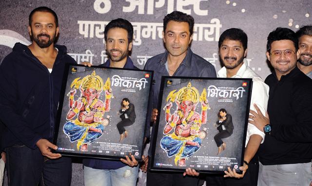 In this photograph taken on July 23, 2017 Rohit Shetty (L), actors Tusshar Kapoor(2L), Bobby Deol (3L), Shreyas Talpade (2R) and Swapnil Joshi (1R) pose for pictures during the music launch of Marathi film Bhikari directed by choreographer Ganesh Acharya in Mumbai. (AFP) In this photograph taken on July 23, 2017 Rohit Shetty (L), actors Tusshar Kapoor(2L), Bobby Deol (3L), Shreyas Talpade (2R) and Swapnil Joshi (1R) pose for pictures during the music launch of Marathi film Bhikari directed by choreographer Ganesh Acharya in Mumbai. (AFP)