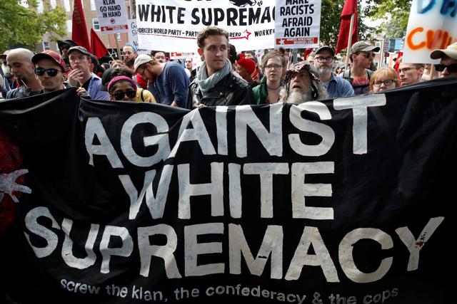 A group of counterprotesters rally against members of white nationalists in Charlottesville, Virginia, US, Saturday. (Reuters) A group of counterprotesters rally against members of white nationalists in Charlottesville, Virginia, US, Saturday. (Reuters)