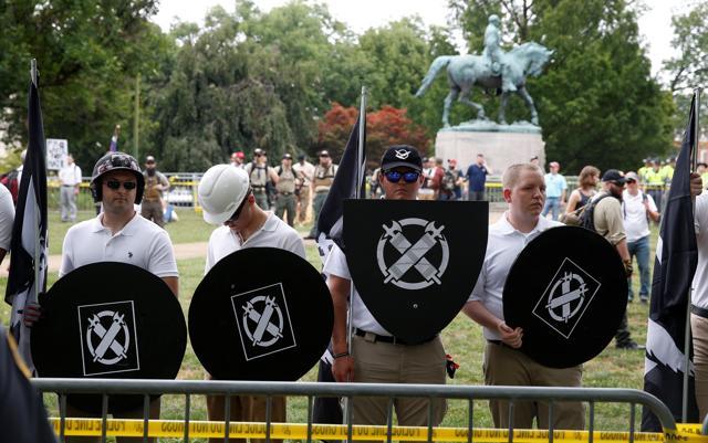 White supremacists gather under a statue of Robert E Lee during a rally in Charlottesville, Virginia, US. (Reuters) White supremacists gather under a statue of Robert E Lee during a rally in Charlottesville, Virginia, US. (Reuters)