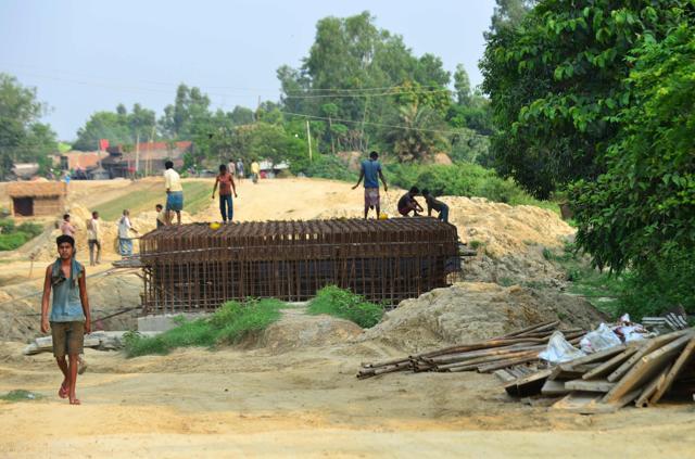 Indian labourers work at the construction of a bridge for the new railway in Janakpur, some 300km south of Kathmandu. (AFP Photo) Indian labourers work at the construction of a bridge for the new railway in Janakpur, some 300km south of Kathmandu. (AFP Photo)