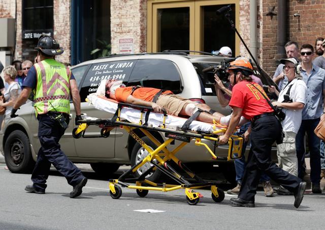 Rescue workers transport a victim who was injured in Charlottesville, Virginia. (Reuters) Rescue workers transport a victim who was injured in Charlottesville, Virginia. (Reuters)