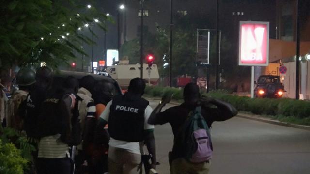 Police are seen on a street following an attack by gunmen on a restaurant in Ouagadougou, Burkina Faso, n this still frame taken from video August 13, 2017. (REUTERS)
