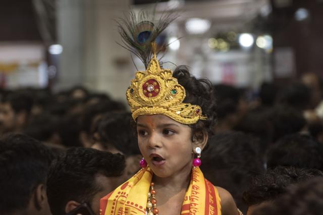 A child dressed as Lord Krishna as part of the festivities. (HT FILE)