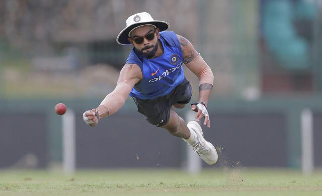 Virat Kohli dives to catch a ball during a training session ahead of their second Test cricket match with Sri Lanka in Colombo, Aug. 1, 2017. (AP) Virat Kohli dives to catch a ball during a training session ahead of their second Test cricket match with Sri Lanka in Colombo, Aug. 1, 2017. (AP)